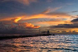 Third Island Pier. View of Sunset from Eniburr Island. by Lee Craker 